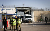 Police and soldiers stand outside the entrance to Ofer Prison outside Jerusalem, where Palestinian terror convicts will be released as part of a deal between Israel and Hamas, November 26, 2023. (Yonatan Sindel/Flash90)