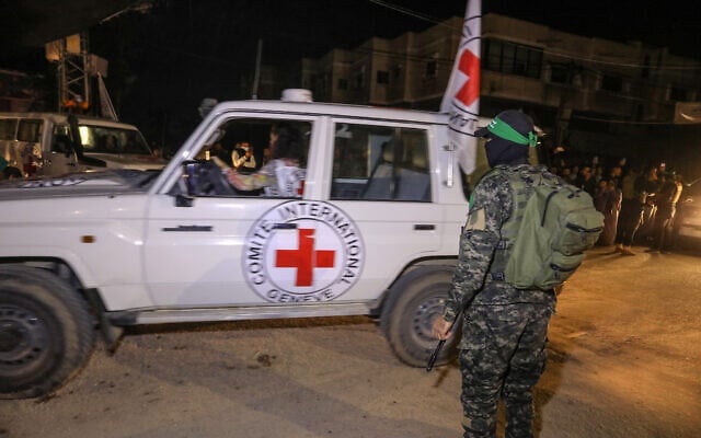 Members of the Hamas and the Islamic Jihad terror groups release Israeli hostages to the Red Cross, in Rafah, in the southern Gaza Strip, November 28, 2023. (Flash90)