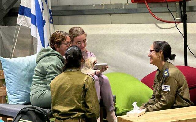 Mia and Gabriela Leimberg call family members from an Israeli army facility after being freed from Hamas captivity on November 28, 2023. (GPO)