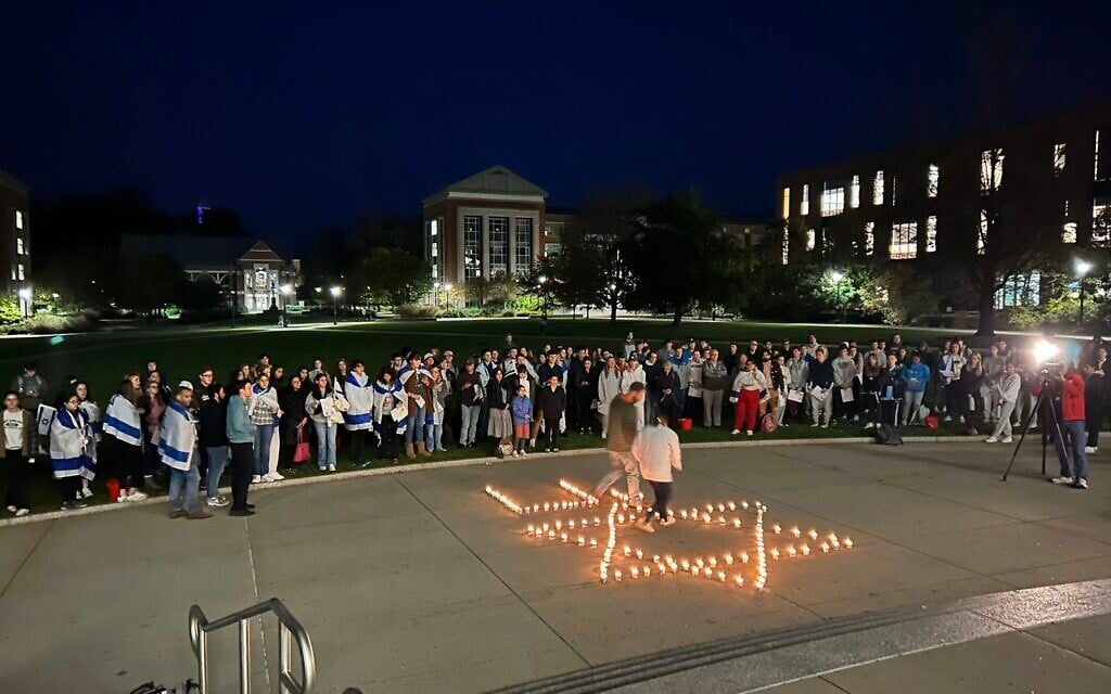 Illustrative: Students at the University of Connecticut hold a candle-lit vigil for victims of the October 7 Hamas atrocities on campus in Storrs, Connecticut, October 8, 2023. (Courtesy)