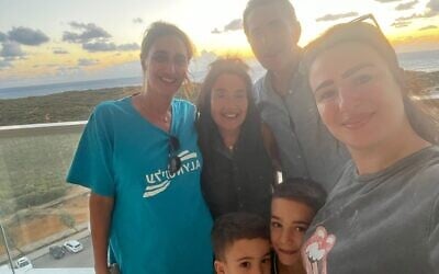 American immigrant Nechama Levy (left) helps a family from Ofakim find safety in a seaside apartment in Netanya. (Courtesy)