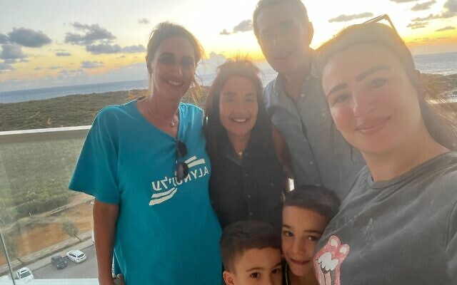 American immigrant Nechama Levy (left) helps a family from Ofakim find safety in a seaside apartment in Netanya. (Courtesy)