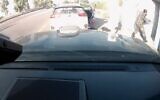 Dashcam footage of Aner Shapira tossing out grenades hurled by Hamas terrorists into a bombshelter near Re'im on October 7, 2023. (Screen capture/X)