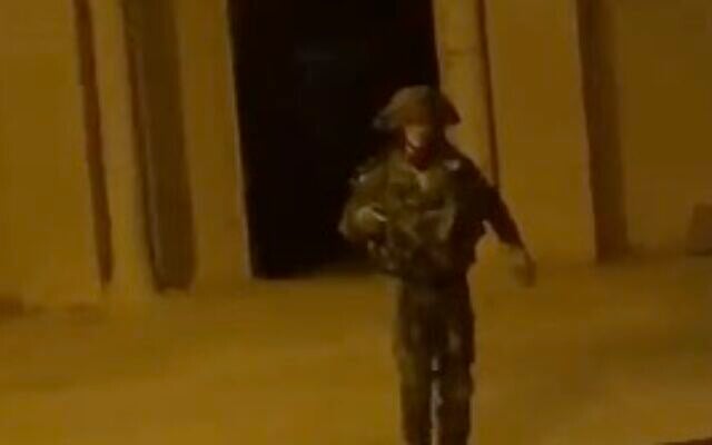 An IDF soldier walks away from throwing a stun grenade into a mosque in the West Bank village of Budrus on November 17, 2023. (Screen capture/X) An IDF soldier walks away from throwing a stun grenade into a mosque in the West Bank village of Budrus on November 17, 2023. (Screen capture/X)