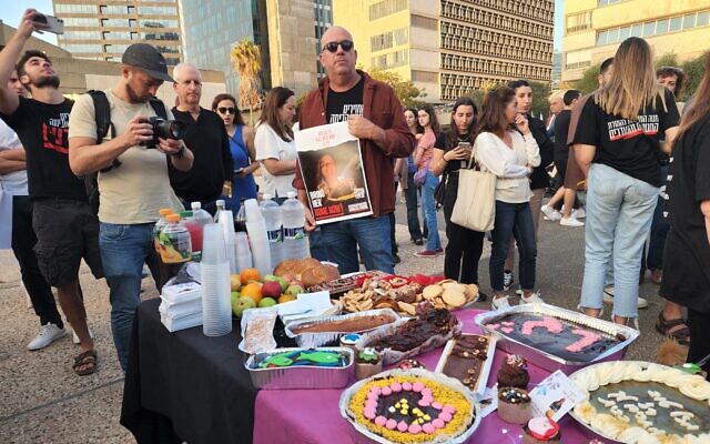 Celebrating the birthday of two hostages -- 57-year-old Raz Ben Ami and 9-year-old Emily Hand -- at Hostages Square in Tel Aviv on November 17, 2023. (Dana Reany) Celebrating the birthday of two hostages -- 57-year-old Raz Ben Ami and 9-year-old Emily Hand -- at Hostages Square in Tel Aviv on November 17, 2023. (Dana Reany)