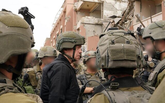 Defense Minister Yoav Gallant speaks with troops in the northern Gaza Strip, November 25, 2023. (Ariel Hermoni/Defense Ministry)