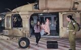 Doron Katz Asher and her daughters Raz and Aviv after their release from Hamas captivity on November 24, 2023.(Israel Defense Forces)