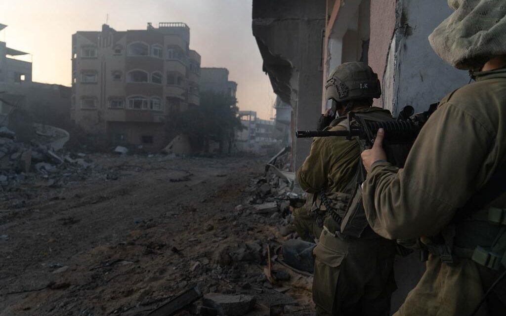 A handout photo cleared for publication  on November 6, 2023, shows IDF soldiers operating in the Gaza Strip. (Israel Defense Forces)