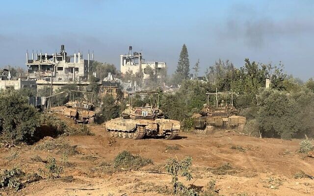 Tanks of the Harel Reserve Brigade are seen in the Beit Hanoun area of northern Gaza, in a handout photo published November 12, 2023. (Israel Defense Forces) Tanks of the Harel Reserve Brigade are seen in the Beit Hanoun area of northern Gaza, in a handout photo published November 12, 2023. (Israel Defense Forces)