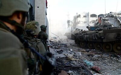 Israeli forces seen operating in northern Gaza in this handout photo released for publication on November 12, 2023. (IDF)