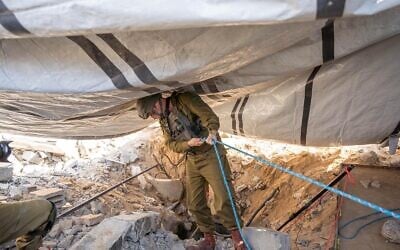 Head of the IDF Southern Command, Maj. Gen. Yaron Finkelman, peers into a tunnel shaft at Gaza City's Shifa Hospital, November 17, 2023. (Israel Defense Forces) Head of the IDF Southern Command, Maj. Gen. Yaron Finkelman, peers into a tunnel shaft at Gaza City's Shifa Hospital, November 17, 2023. (Israel Defense Forces)