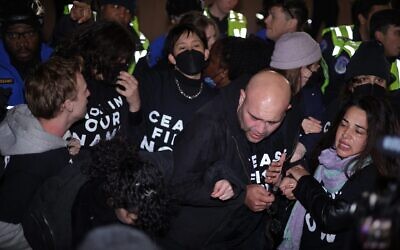 Members of US Capitol Police push protesters away from the headquarters of the Democratic National Committee during a far-left Jewish demonstration against the war between Israel and Hamas, on Capitol Hill, Nov. 15, 2023. (Alex Wong/Getty Images via JTA)