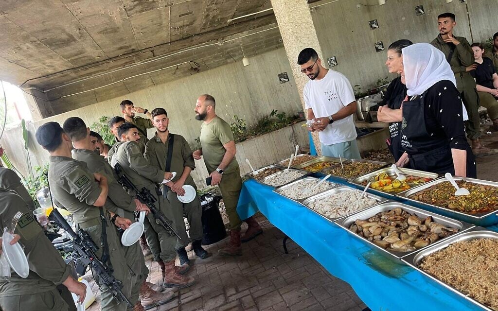 Soldiers at a training base in northern Israel wait to eat food cooked by Druze chef Noura Noura Hossessi. (Courtesy, Noura Houssessi)