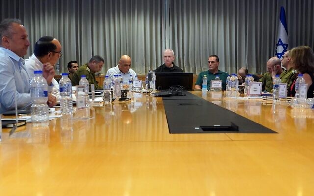 Defense Minister Yoav Gallant meets with officials during a meeting of the upper committee for the economy during an emergency, on November 9, 2023. (Ariel Hermoni/Defense Ministry)