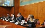Foreign Minister Eli Cohen and family members of hostages held by Hamas in Gaza hold a briefing for UN ambassadors in Geneva, November 15, 2023. (Pierre-Michel Virot/Israeli delegation to the UN Offices in Geneva)