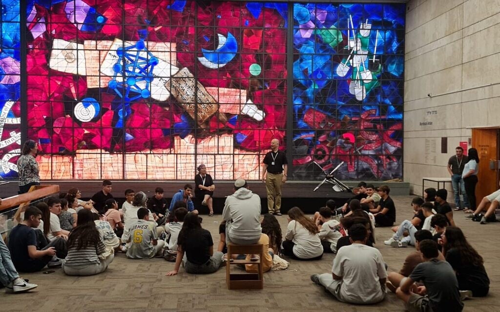 Class being held in front of the iconic stained glass windows at the old National Library of Israel building in Jerusalem, in an undated photo. (courtesy)