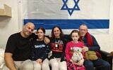Emily Hand (second from right) reunites with her father, Tom Hand (right) while Hila Rotem (second from left), whose mother is still held hostage, reunites with family members in the early hours of November 26, 2023. (Courtesy; clause 27a of the copyright law)