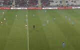 Soccer players from Israel and Poland stand for an unauthorized minute's silence ahead of their game on Novemebr 17, 2023 (Screen grab from Sport 5 used in accordance with Clause 27a of the Copyright Law)