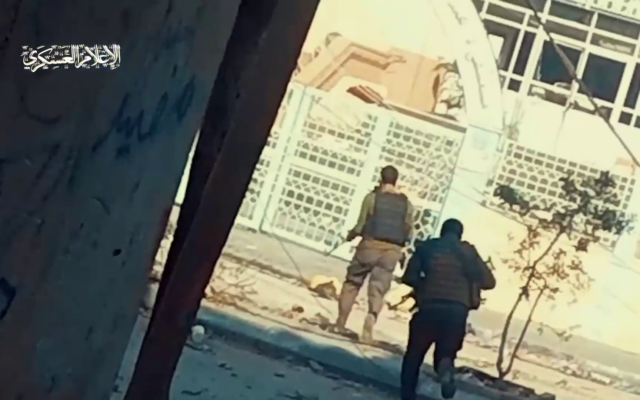 This screenshot from a Hamas video published November 19, 2023, shows terror operatives storming Gaza's Rantisi Hospital. (Screenshot: X) This screenshot from a Hamas video published November 19, 2023, shows terror operatives storming Gaza's Rantisi Hospital. (Screenshot: X)