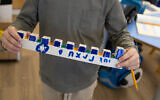 Children from evacuated communities in the Gaza envelope and the north of Israel make menorahs to send to IDF soldiers fighting Hamas in the Gaza Strip (IDF)