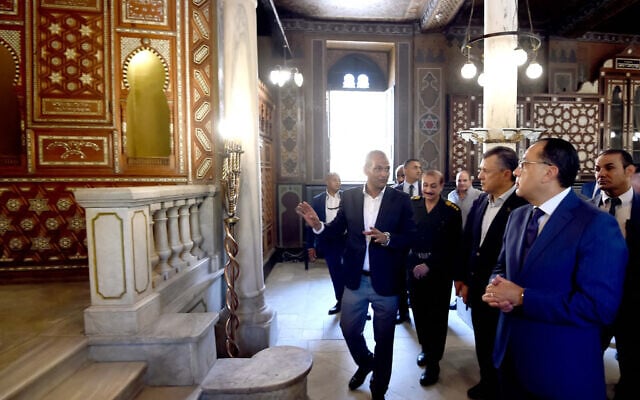 Egyptian Prime Minister Mostafa Madbouli (2nd-R) and Tourism and Antiquities Minister Ahmed Issa (3rd-R) touring around the newly-restored 19th century Jewish synagogue of Ben Ezra in Coptic Cairo on August 31, 2023. (Photo by Egypt's Prime Minister Office / AFP)