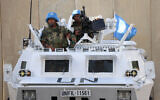 Illustrative - Peacekeepers of the United Nations Interim Force in Lebanon (UNIFIL) man their armored vehicle in Lebanon's southern town of Naqoura near the border with Israel, on October 15, 2023. (AFP)