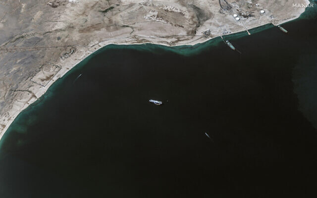 This handout satellite picture released by Maxar Technologies on November 28, 2023, shows the recently seized Israeli-linked Galaxy Leader ship (C), that was captured by Houthi rebels on November 19, next to a support vessel in the southern Red Sea near Hodeida, Yemen. (Photo by Satellite image ©2023 Maxar Technologies / AFP) This handout satellite picture released by Maxar Technologies on November 28, 2023, shows the recently seized Israeli-linked Galaxy Leader ship (C), that was captured by Houthi rebels on November 19, next to a support vessel in the southern Red Sea near Hodeida, Yemen. (Photo by Satellite image ©2023 Maxar Technologies / AFP)