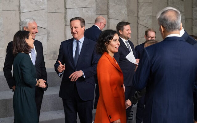 British Foreign Secretary David Cameron (3rd left) speaks with German Minister of Foreign Affairs Annalena Baerbock (left) after a group photo as they attend a NATO Foreign Ministers meeting at NATO Headquarters in Brussels, on November 28, 2023. (SAUL LOEB / POOL / AFP) British Foreign Secretary David Cameron (3rd left) speaks with German Minister of Foreign Affairs Annalena Baerbock (left) after a group photo as they attend a NATO Foreign Ministers meeting at NATO Headquarters in Brussels, on November 28, 2023. (SAUL LOEB / POOL / AFP)