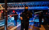 A police officer stands guard at the scene of a stabbing in Paris on December 2, 2023. (Dimitar Dilkoff/AFP)