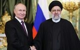 File - Russian President Vladimir Putin (left) shakes hands with Iranian President Ebrahim Raisi during their meeting in the Kremlin on December 7, 2023, in Moscow. (Sergei Bobylyov/Pool/AFP)