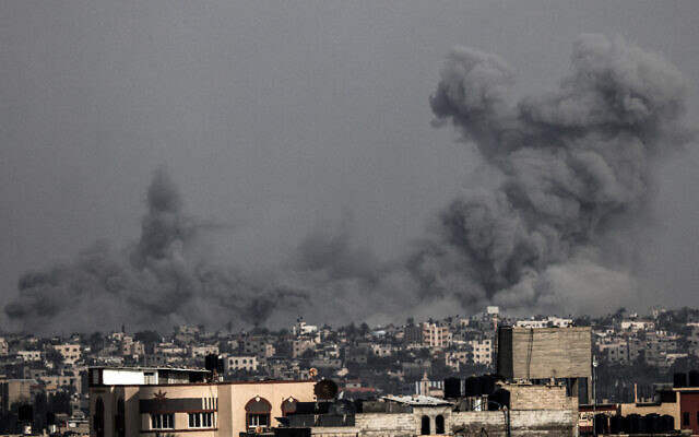 A picture taken from Rafah shows smoke billowing above buildings during Israeli strikes on Khan Younis in the southern Gaza Strip on December 9, 2023 (MAHMUD HAMS / AFP) A picture taken from Rafah shows smoke billowing above buildings during Israeli strikes on Khan Younis in the southern Gaza Strip on December 9, 2023 (MAHMUD HAMS / AFP)