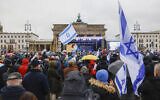 People take part in a demonstration against antisemitism at the Brandenburg Gate in Berlin, on December 10, 2023. (MICHELE TANTUSSI / AFP)