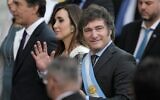 Argentina's new president Javier Milei waves as he arrives accompanied by vice president Victoria Villarruel (C-L) and members of his cabinet to attend an interfaith ceremony at the Metropolitan Cathedral, in Buenos Aires, on December 10, 2023. (Juan Mabromata / AFP)