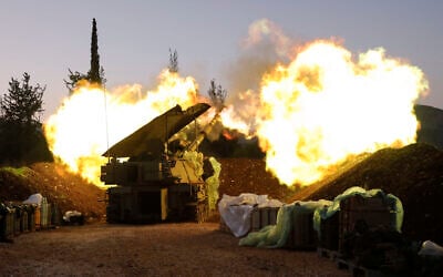 An Israeli artillery unit fires from a position in Upper Galilee in northern Israel towards southern Lebanon, on December 11, 2023 (Photo by jalaa marey / AFP)