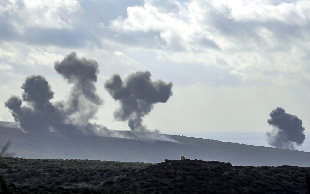 Smoke billows after Israeli strikes in the forested hills of the village of Labbouneh in southern Lebanon near the border with northern Israel on December 13, 2023. (AFP)