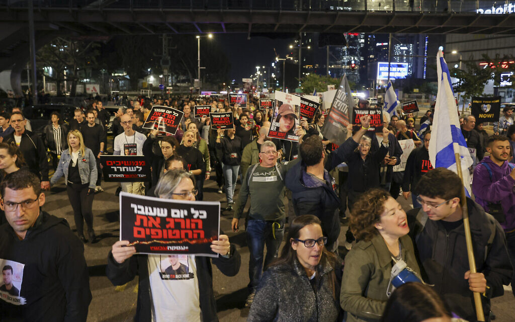 Families and supporters of hostages abducted during the Hamas-led Oct. 7 onslaught demonstrate outside the Defense Ministry in Tel Aviv on December 15, 2023, calling for an agreement for the return of the hostages. (Ahmad Gharabli/AFP)