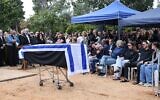 Relatives and friends mourn as they gather for the funeral of Alon Shamriz, an Israeli hostage who was mistakenly killed by the IDF in Gaza, in Kibbutz Shefayim on December 17, 2023. (Oren ZIV / AFP)