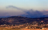Smoke billows on the outskirts of the village of Kfarshuba, along Lebanon's southern border with northern Israel following Israeli bombardment on December 20, 2023. (AFP)