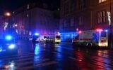 Ambulances and police cars are seen near the Charles University in central Prague, on December 21, 2023, amid a mass shooting. (Michal CIizek/AFP)