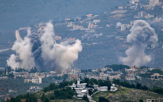 Smoke billows after Israeli strikes over Lebanon's southern town of Kfar Kila near the border with Israel on December 21, 2023. (AFP) Smoke billows after Israeli strikes over Lebanon's southern town of Kfar Kila near the border with Israel on December 21, 2023. (AFP)
