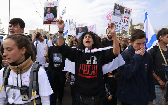 Israelis march to call for the release of hostages abducted by Hamas to Gaza during the October 7 onslaught, in Jerusalem on December 28, 2023. (Menahem Kahana/AFP) Israelis march to call for the release of hostages abducted by Hamas to Gaza during the October 7 onslaught, in Jerusalem on December 28, 2023. (Menahem Kahana/AFP)