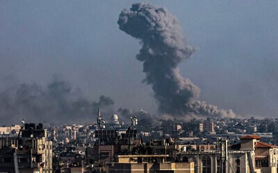 A picture taken from Rafah shows smoke billowing over Khan Younis in the southern Gaza Strip during Israeli strikes on December 30, 2023, as the war between the Palestinian Hamas terror group and Israel continues. (AFP)