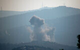 Smoke billows after Israeli bombardment over Lebanon's southern town of Kafr Kila near the border with Israel on December 30, 2023, amid ongoing cross-border skirmishes between Israeli forces and Hezbollah as the Israel-Hamas war in Gaza continues. (AFP)