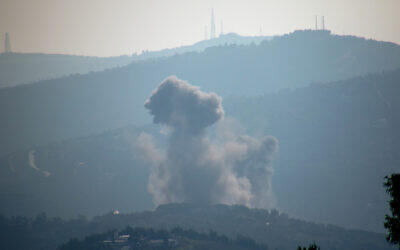 Smoke billows after Israeli bombardment over Lebanon's southern town of Kafr Kila near the border with Israel on December 30, 2023, amid ongoing cross-border skirmishes between Israeli forces and Hezbollah as the Israel-Hamas war in Gaza continues. (AFP)