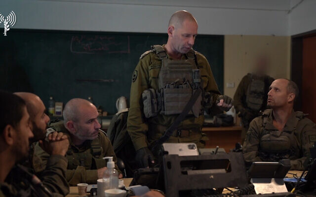 The head of the IDF Southern Command, Maj. Gen. Yaron Finkelman (center) speaks to commanders of the Golani Brigade in Gaza City’s Shejaiya neighborhood, December 13, 2023. (Israel Defense Forces)