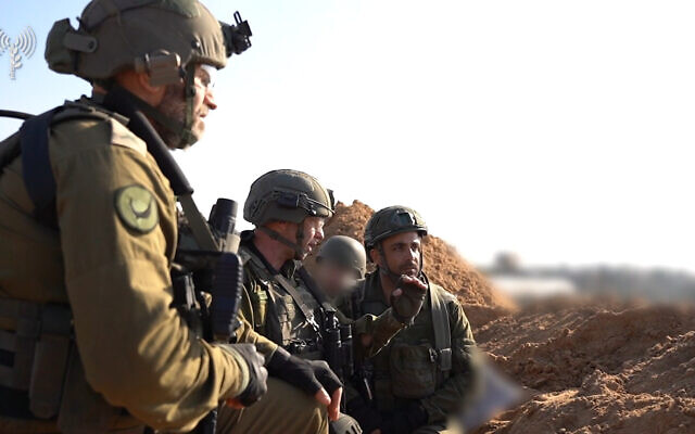 Head of the IDF Southern Command, Maj. Gen. Yaron Finkelman (center), speaks to forces in the southern Gaza Strip, December 6, 2023. (Israel Defense Forces) Head of the IDF Southern Command, Maj. Gen. Yaron Finkelman (center), speaks to forces in the southern Gaza Strip, December 6, 2023. (Israel Defense Forces)