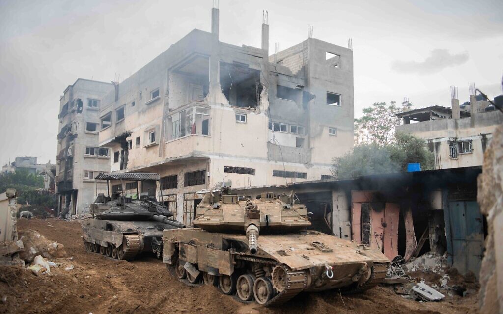 IDF armored vehicles positioned inside the Gaza Strip in an undated photo released by the military on December 28, 2023. (Israel Defense Forces)