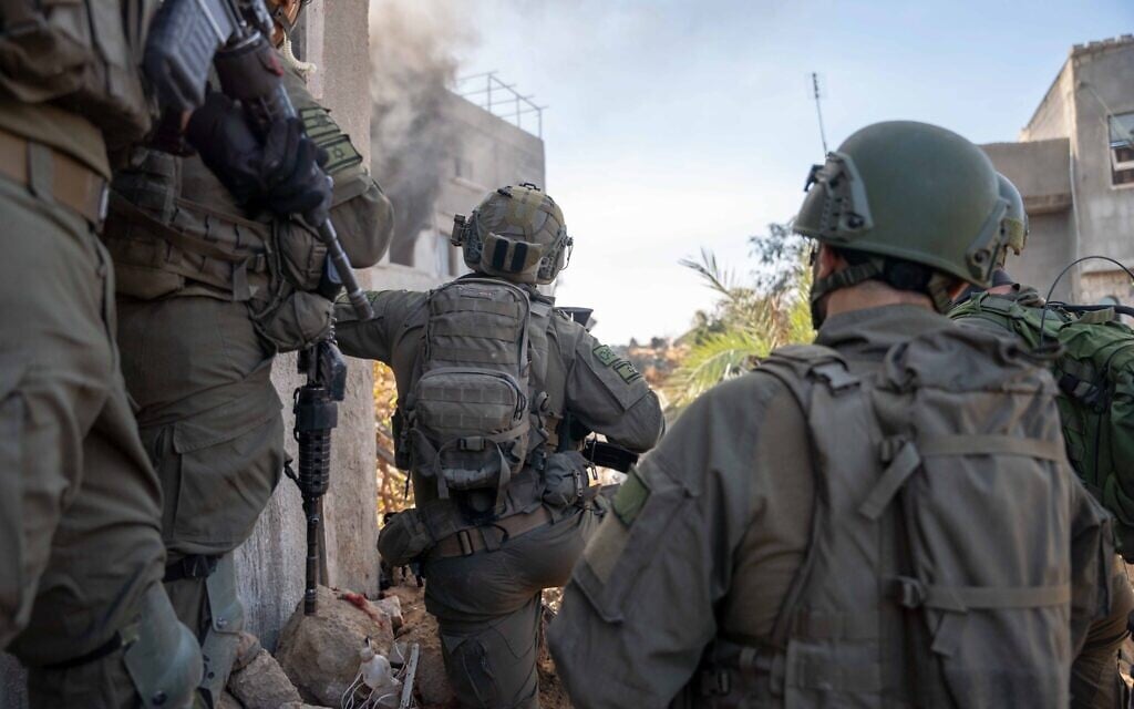 IDF troops seen operating in the Gaza Strip in a handout photo released December 24, 2023. (Israel Defense Forces)