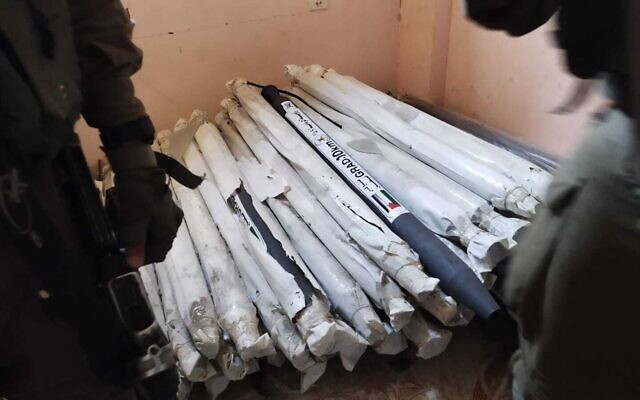 Dozens of rockets found by Israeli troops inside a residential home in northern Gaza, December 2, 2023. (Israel Defense Forces) Dozens of rockets found by Israeli troops inside a residential home in northern Gaza, December 2, 2023. (Israel Defense Forces)