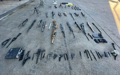 Weapons seized by IDF troops in the West Bank's Nur Shams refugee camp, December 26, 2023. (Israel Defense Forces)